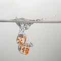 Clear game dice drop in clear water with a splash Royalty Free Stock Photo