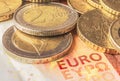 Some coins of euro on a banknote of ten euros Royalty Free Stock Photo