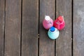 some colored glass bottles on some dark wooden planks