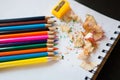 Some colored pencils of different colors and a pencil sharpener Royalty Free Stock Photo