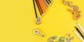 Some colored pencils of different colors and a pencil sharpener and pencil shavings on ÃÂ° yellow background Royalty Free Stock Photo