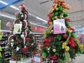 Some colorful Christmas trees with decorations at a departmental store