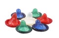 Some colour condoms on a white background Royalty Free Stock Photo