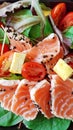 Delicious slices of scalded salmon with salad