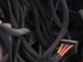 Some dusty power supply cables in a computer case with poor cable management