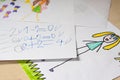 Some children`s drawings and calculations