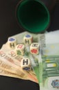 Some euro bills next to poker dice on a game table Royalty Free Stock Photo