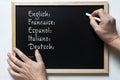 Some european languages written on a blackboard Royalty Free Stock Photo