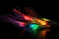 Some fibre optic cables glowing at the end in different colors against a black background created with generative AI technology