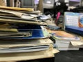 Some file folders stacked on top of a desk