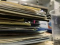 Some file folders stacked on top of a desk