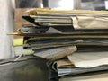 Some file folders stacked on top of a desk