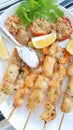 Fish skewers with shrimp and swordfish baked in the oven Royalty Free Stock Photo