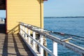 Some fishing rod holders mounted on railing fence at Queenscliff pier. Royalty Free Stock Photo