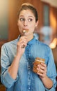 Some foods just taste better eaten straight from the jar. a young woman eating peanut butter out of the jar with a spoon Royalty Free Stock Photo