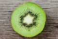 Some fresh Kiwi Fruits on an old wooden table