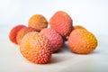 Some fresh lychees on a white cutting board Royalty Free Stock Photo