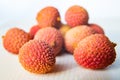 Some fresh lychees on a white cutting board Royalty Free Stock Photo