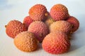Some fresh lychees on a white cutting board Royalty Free Stock Photo