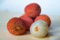Some fresh lychees on a white cutting board Royalty Free Stock Photo