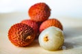 Some fresh lychees on a white cutting board Royalty Free Stock Photo