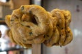 Some freshly baked bagels on shelf in bakery shop.