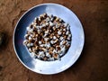 Some fried maize and soyabin in the middle of silver plate Royalty Free Stock Photo