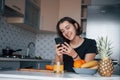 Some funny stuff. Girl in the modern kitchen at home at her weekend in the morning time Royalty Free Stock Photo