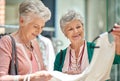 This is some good quality fabric. a two senior women out on a shopping spree. Royalty Free Stock Photo