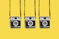 retro film cameras on a yellow background Royalty Free Stock Photo