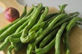 Some green beans and a red onion Royalty Free Stock Photo