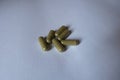 Some green capsules of moringa Royalty Free Stock Photo