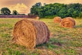 Hay bales in a medow at sunset Royalty Free Stock Photo