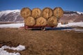 Some hay bales in the snow in Pian grande and Mount Vettore in the background, Castelluccio di Norcia, Umbria, Italy Royalty Free Stock Photo