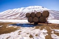 Some hay bales in the snow in Pian grande and Mount Vettore in the background, Castelluccio di Norcia, Umbria, Italy Royalty Free Stock Photo