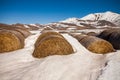 Some hay bales in the snow in Pian grande and Mount Vettore in the background, Castelluccio di Norcia, Umbria, Italy Royalty Free Stock Photo