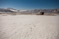 Some hay bales in the snow in Pian grande and Mount Vettore in the background, Castelluccio di Norcia, Umbria, Italy Royalty Free Stock Photo