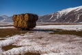 Some hay bales in the snow in Pian grande and Mount Vettore in the background, Castelluccio di Norcia, Umbria, Italy Royalty Free Stock Photo