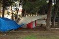 Some homeless tents in forest near road. Sad situation of America