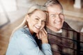 Some hope for a happy marriage, we create one. an affectionate mature couple relaxing together at home. Royalty Free Stock Photo