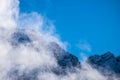 Natural landscape image of close up clouds over snow mountain