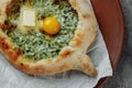 Some khachapuri traditional Georgian homemade cheese and spinach pies on the plate