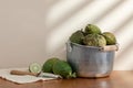 Some lemons and a knife on the table.  Cut lemon.  Lemons in the iron bucket Royalty Free Stock Photo