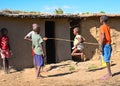 Some maasai children play jumping jacks beside their home