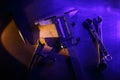 Some metal tools at workplace in blue light.