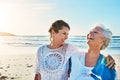 Some much needed mother and daughter time. a senior woman and her adult daughter spending a day at the beach. Royalty Free Stock Photo