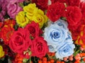 Some multiple colored artificial rose flowers on display for sale Royalty Free Stock Photo