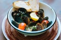 Selective focus of mussels with lemon and cherry tomatoes