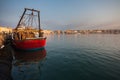 Some old wooden fisher boats are slowly rocking in harbor during a beautiful morning Royalty Free Stock Photo