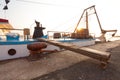 Some old wooden fisher boats are slowly rocking in harbor during a beautiful morning Royalty Free Stock Photo